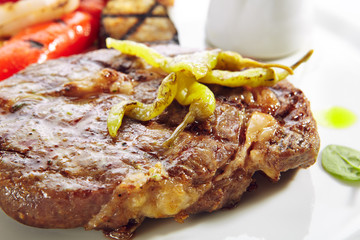 Macro Shot of Pork Neck Steak with Grilled Vegetables Isolated