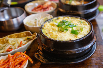 Korean style steam egg dish and vegetables on wood table. Korean Food.