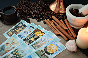 Tarot cards and fortune telling, canvas napkin background, coffee сup and coffee beans