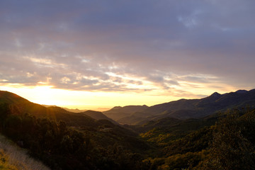 Sunrise morning landscape on a green forest mountain valley in Catalonia mountains