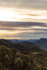 Brown cloudy sunrise on a green mountain landscape in Girona, Catalonia