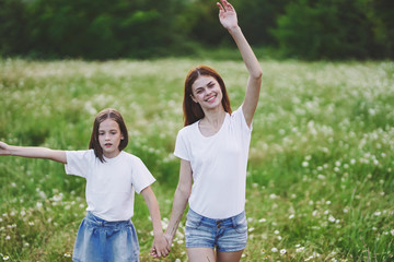 Fototapeta premium mother and daughter having fun in the park