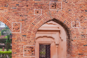 Fototapeta na wymiar Bullet holes at the Jallianwala Bagh massacre site in Amritsar, Punjab state, India