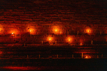 candles decorating a Stupa, Full Moon festival