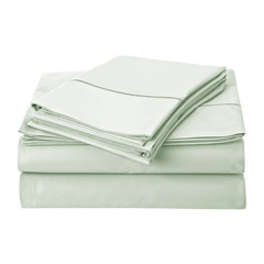 Stacked solid cotton fabric isolated over white background.