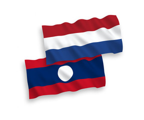Flags of Laos and Netherlands on a white background