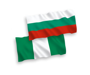 National vector fabric wave flags of Bulgaria and Nigeria isolated on white background. 1 to 2 proportion.