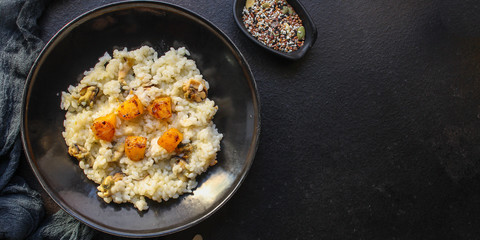 risotto mussels, pumpkin (main course, rice seafood) menu concept. food background. top view. copy space