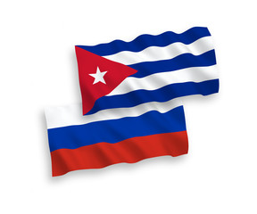 National vector fabric wave flags of Cuba and Russia isolated on white background. 1 to 2 proportion.
