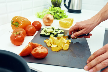 woman cutting vegetables in the kitchen