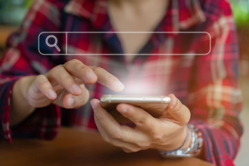 People hand using mobile phone or smartphone searching for information in internet online society...
