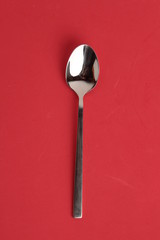 silver spoon isolated on colorful background