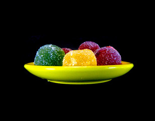 color marmalade isolated on black background