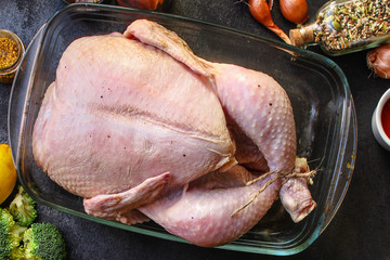 raw chicken in marinade (poultry, carcass meat) menu concept. food background. top view. copy space