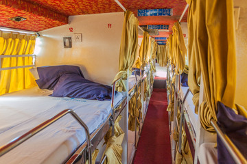 BHOPAL, INDIA - FEBRUARY 5, 2017: Interior of a sleeper bus in India © Matyas Rehak