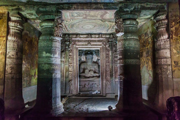 AJANTA, INDIA - FEBRUARY 6, 2017: Interior of a Buddhist cave carved into a cliff in Ajanta, Maharasthra state, India