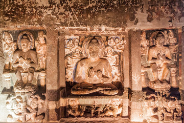 AJANTA, INDIA - FEBRUARY 6, 2017: Buddha images in a  monastery carved into a cliff in Ajanta, Maharasthra state, India