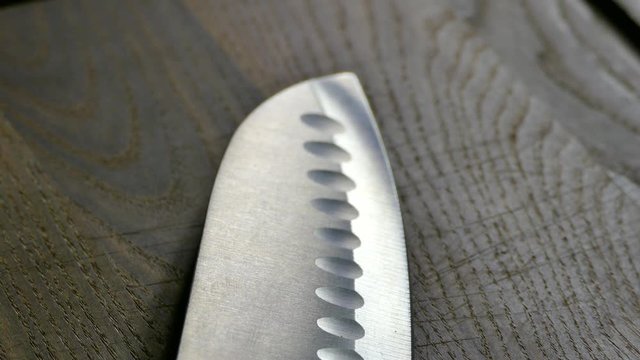 Chef's knife. Santoku kitchen knife. Cook in the kitchen.