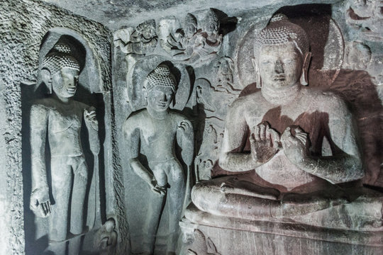 AJANTA, INDIA - FEBRUARY 6, 2017: Buddha images in a  monastery (vihara) carved into a cliff in Ajanta, Maharasthra state, India