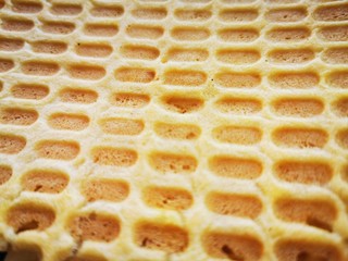 The surface texture of waffles, homemade cakes, sweet dessert. Delicious snack. Tasty food.