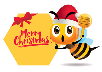 Merry Christmas. Cartoon cute bee one hand pointing to signboard with Merry Christmas lettering, one hand holding a honey dipper. - vector character