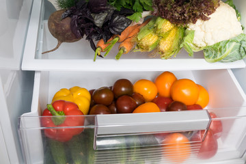 storage of vegetables in the refrigerator, top view, close-up