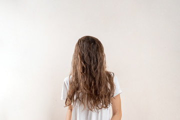 No face portrait of young woman with brown messy hair. Sleepy concept