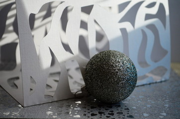 carved paper composition with christmas toy and bokeh