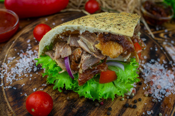 doner kebab on dark wooden kitchen table