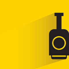 beverage, alcohol bottle with drop shadow yellow background
