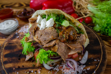 doner kebab on dark wooden kitchen table