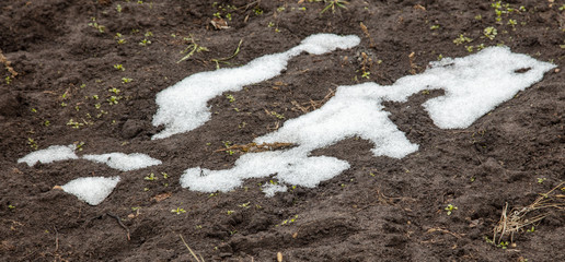 White snow on black ground