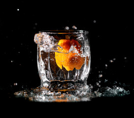 tangerine fruit in water with spray
