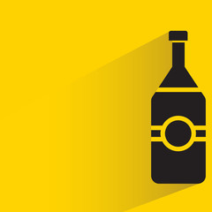 beverage bottle with drop shadow in yellow background
