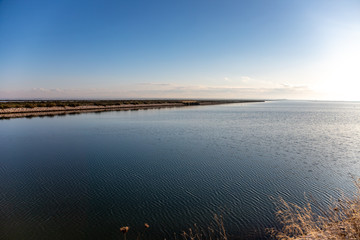 Nature reserve Saline Margherita di Savoia, Apulia, Italy: The salt pan. Salt flats area for sea salt production. A salt marsh, a coastal ecosystem on Adriatic sea.