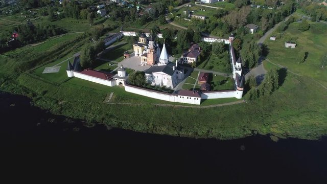 View of the old Staritsky Holy Dormition monastery, August evening (aerial video). Tver region, Russia 
