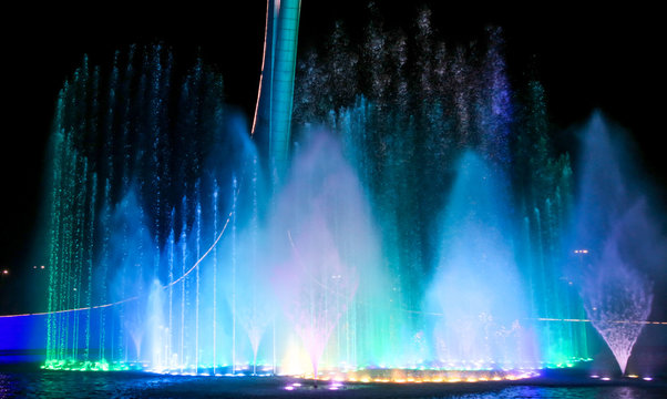 A Dancing Fountain Of Blue In The Park