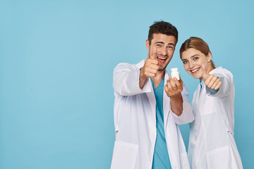 man and woman with thumbs up