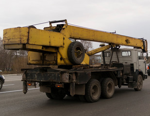 Mobile construction hydraulic crane truck on the road.