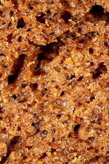 Black rye bread as an abstract background