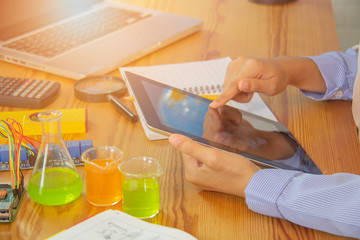 Muslim women are using tablets in the STEM study. Electronic labs are boards that can be programmers, computer programming technology.