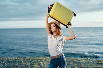woman holding a sign on the beach