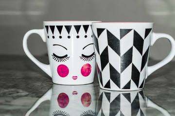 beautiful designed coffee cups with women shape face  