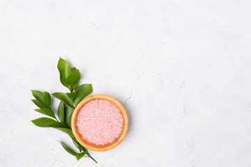 Beauty and spa concept. Sea salt, green leaves and shells on white background. Flat lay. Copy space. 
