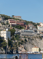  View of houses and hotels on the cliffs in Sorrento. Gulf of Naples, Campania, Italy