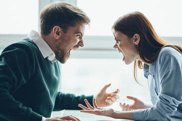 young couple using digital tablet in cafe