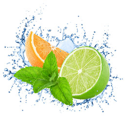 Cutted orange and lime with mint in water splashes isolated on white background.