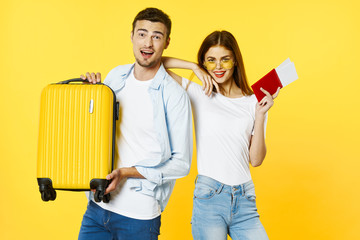 couple painting wall with paint roller