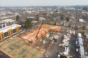 Fototapeta na wymiar Texture. Construction of complexes with construction equipment and people. Top view. New house construction.