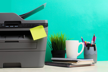 Printer, copier, scanner on color background . Office table - Image